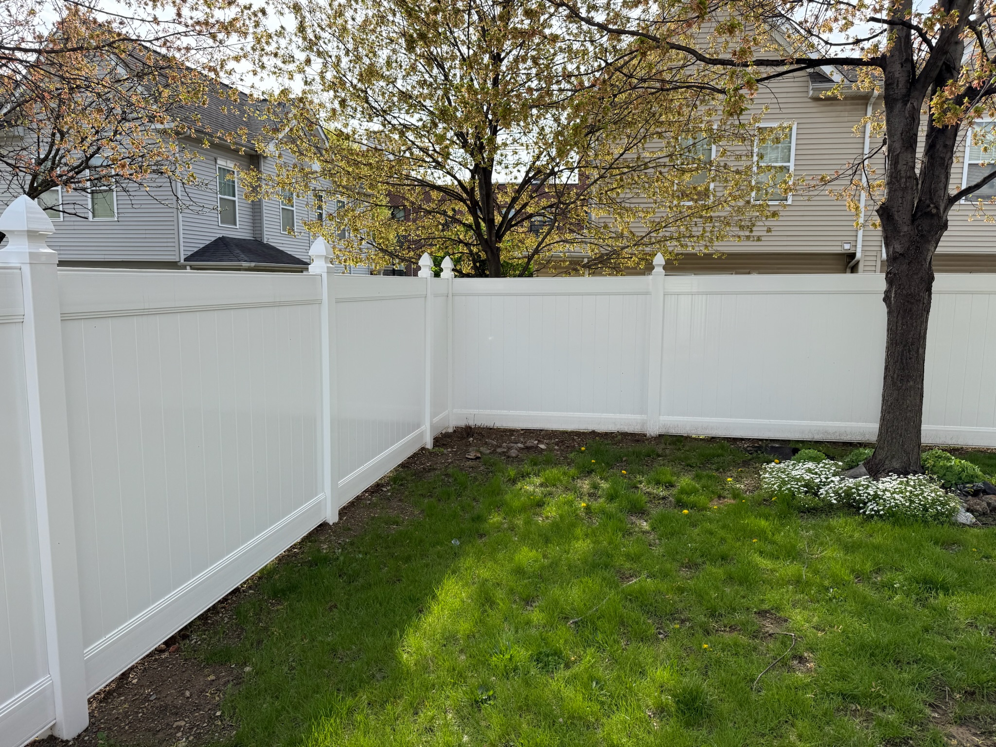 Gray vinyl semi-privacy fence